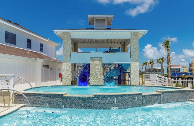 Cozy One-Bedroom Townhome steps from the beach Wifi, heated pool!Coastal retreat