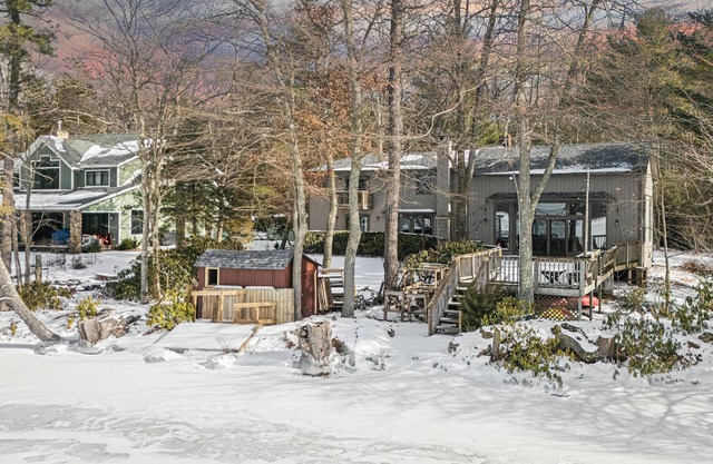 Deck w/ Lake Views, Fireplace, Shuffleboard, and Office | Lakeside Retreat