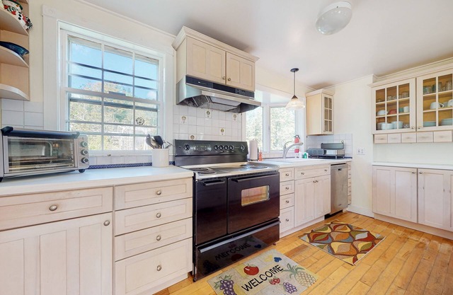 Delightful updated farmhouse with original features, patio, and & W/D