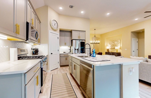 Designer home with luxe suite, home office, outdoor lounge & dog-friendly yard