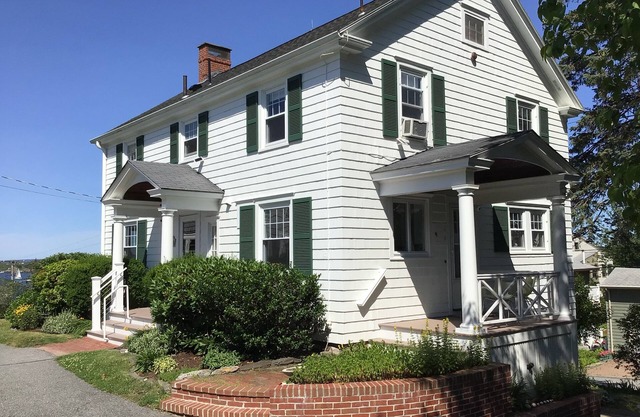 Distinguished classic coastal home overlooks Casco Bay and Maine’s rocky shore!