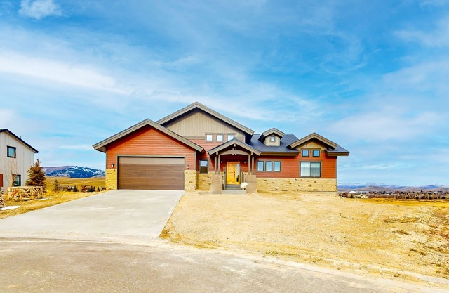 Dog-friendly golf course-front home with mtn & ski views, fireplace, & balconies
