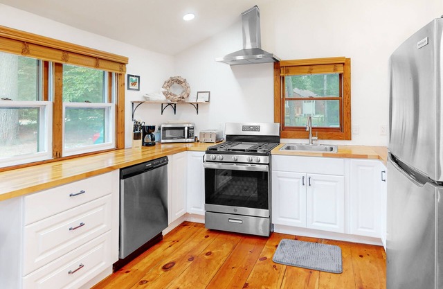 Dog-friendly home with beach access, a firepit, pool table, & washer/dryer
