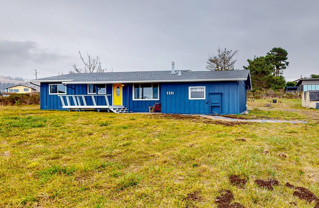 Dog-friendly home with ocean/sunset views, large yard, & firepit