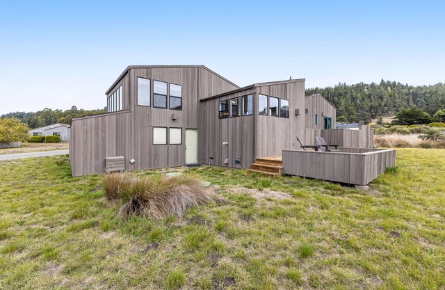 Dog-friendly home with private hot tub, ocean/meadow views & shared pools