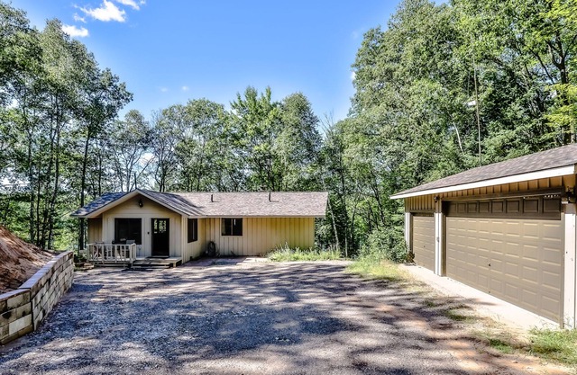 Dog-friendly, lakefront retreat with a dock, washer/dryer, central AC, & firepit