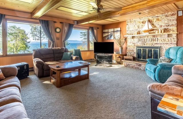 Dog-friendly lakefront home & guest house with private beach, dock, & firepit