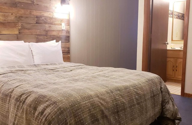Dog Friendly, Private Guestroom with TWO QUEEN beds and two small bathrooms inside the Lodge at North Ironwood Acres resort.