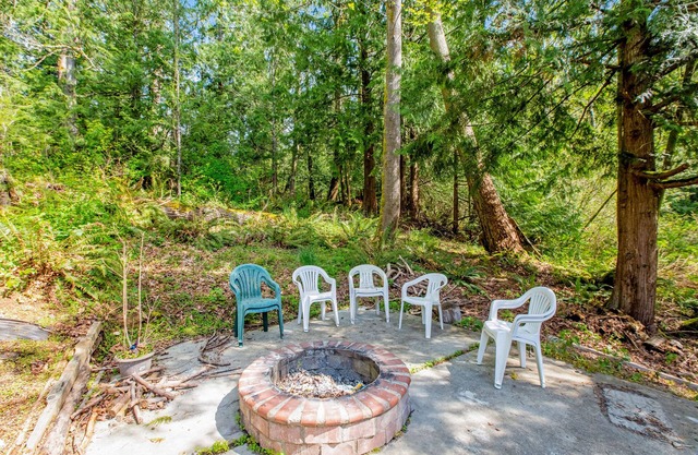 Dog-friendly retreat with a large deck, hot tub, grill, firepit, and game room