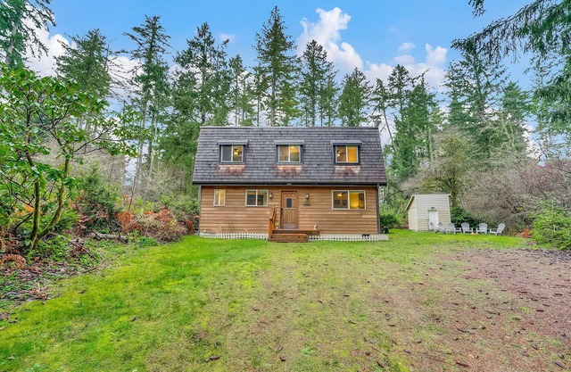 Dog-friendly storybook home in the trees with tennis, pickleball & beach access