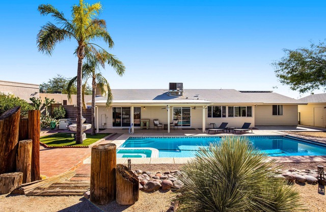 Dog-friendly sunshine stay with private pool, spacious yard, central AC & W/D