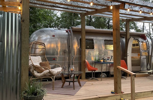 Dog-friendly vintage camper with grill, firepit, river access, & outdoor theater