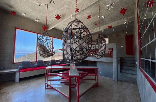 Eclectic Cliffside Den with Hanging Living Area