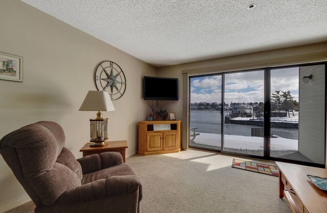 Edgewater Inn 115 | Sunrise Over Lake Charlevoix | Pool, Hot Tub, Sauna