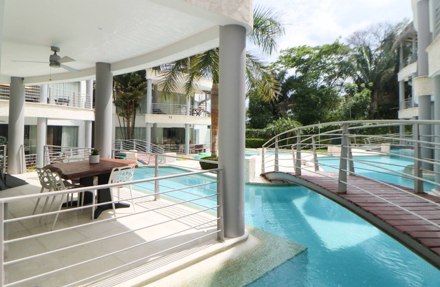 Elegant condo with private pool, AC, lanai with resort pool view - walk to beach