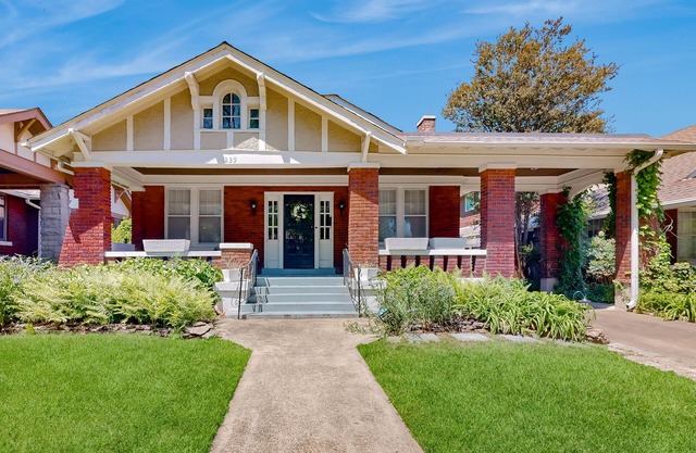 Elegant home with abundant outdoor living areas, library & dog-friendly yard