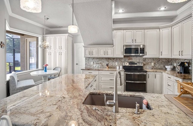 Elegant home with office, theater and heated pool