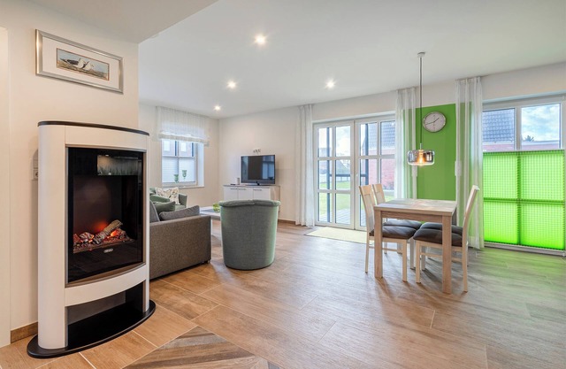 Ella - Moderne und komfortable Ferienwohnung mit sonniger Terrasse.