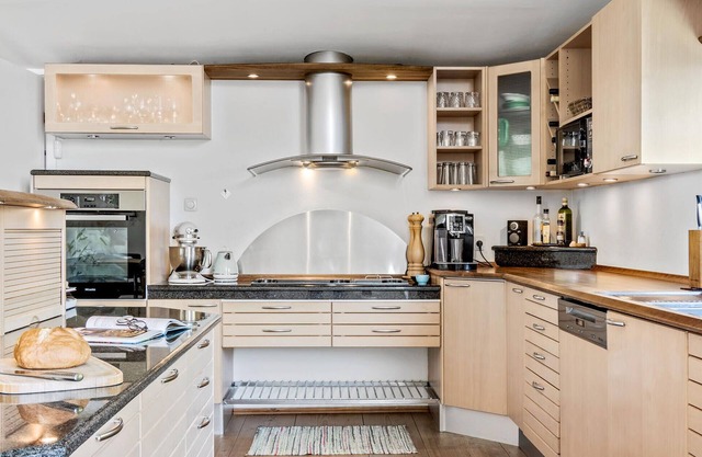 Enjoy a relaxing holiday in this holiday home with sea views near Vejle Fjord.