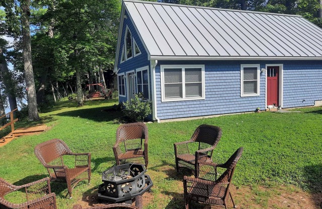 Enjoy amazing sunsets while steps from North Pond in this cozy 3-bedroom camp.