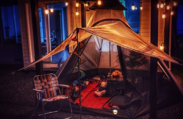 Enjoy camping in a well-maintained yard with a firepit, hot tub and a pool table