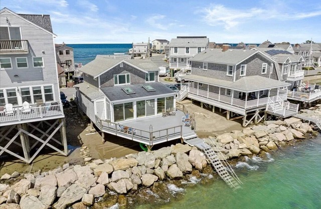 Enjoy serene oceanfront home with harbor views.