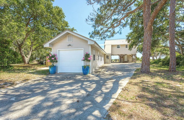 Enjoy Unbeatable Sunsets at this Gulf Getaway, 4 Bedroom House on a large beach lot with fire pit!