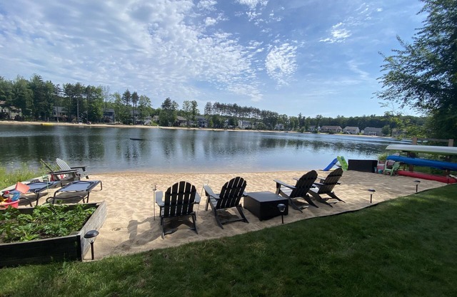 Entire house with beach on large swimming pond with hot tub