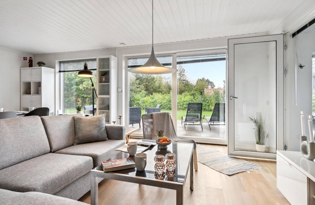Escape from your everyday life and relax in this beautiful wooden house in Virksund.