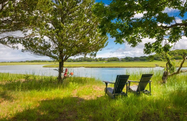 Escape to The Hideaway in East Sandwich fronting on Scorton Creek and tidal marsh!