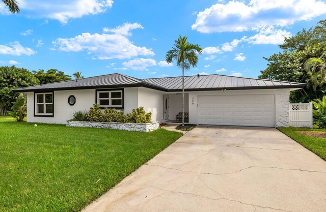 Exceptional canal front home, beautiful design, steps to beach!
