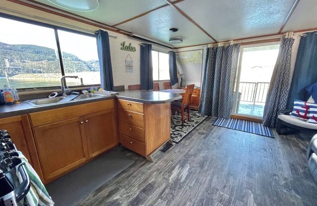 Experience the ultimate waterfront escape on our stunning Three Buoys Houseboat