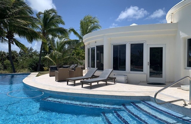Exquisite Contemporary Beachfront Estate with Pool on Pink Sand Beach