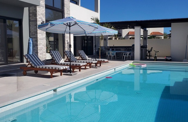 Exquisite Exclusive Elegant 4 Bdrm 6 bth heated pool moutain & golf course views