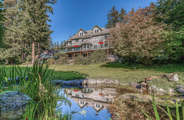 Family friendly water view escape with deck, games and garden views