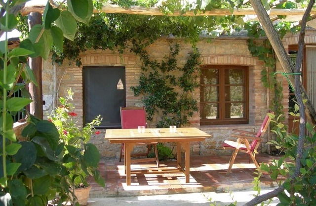 Farmhouse from 17th century with antique furniture and many flowers.