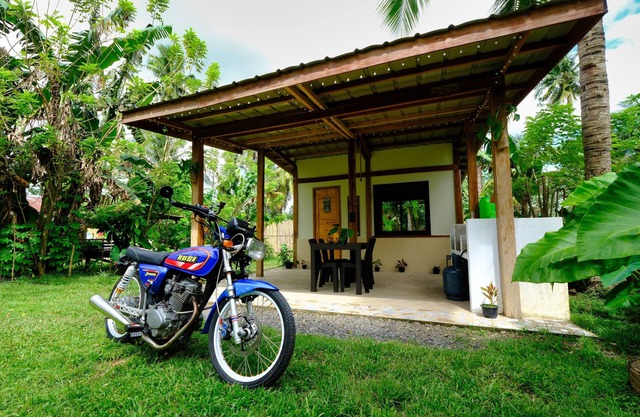 Filipino style cabin in the nature of Albay, surrounded by green volcano hills