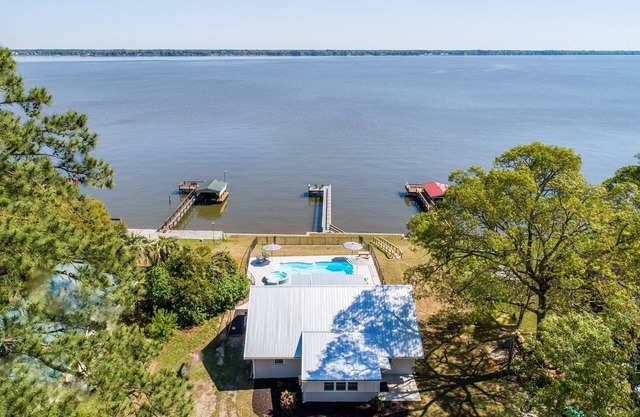 Fully renovated 1959 lake front cottage. In-ground swimming pool and spa.