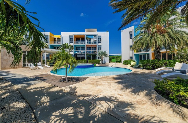 Gated community with resort-style amenities - 2 bedroom, 2 bath with an open concept living room and kitchen. Private balcony overlooks pool area.