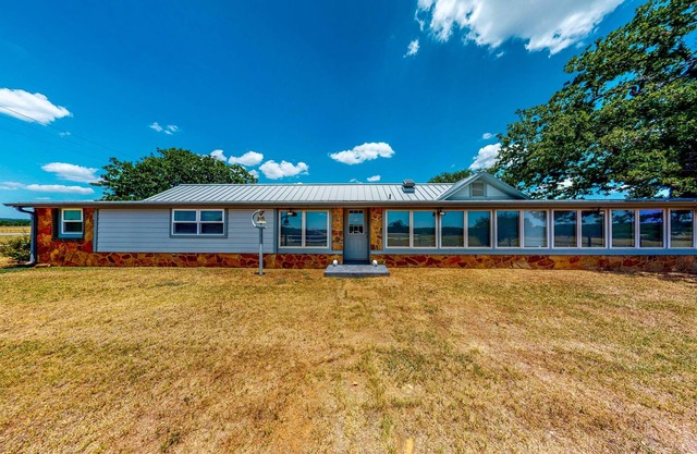 Gated Home next to Lake with Gorgeous Sunroom, Game Room & Fireplace
