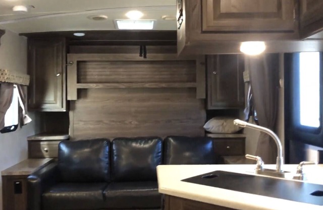 Glamp in a cozy RV waking up to Nature Trails out your front door.