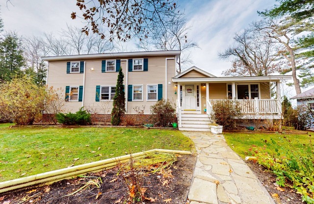Glistening lakefront home with fireplace, kitchen, dock, canoe, grill, & patio