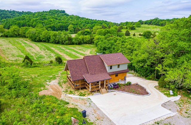 Gorgeous custom log cabin on 185 acres