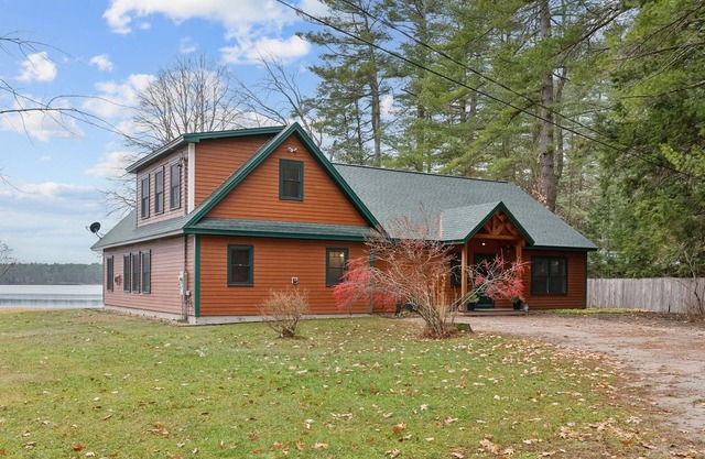 Gorgeous luxury home with large sandy beach and sunset views on Brandy Pond!