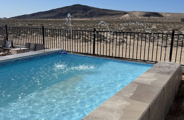 Gorgeous mountain views just 200 yards from the beach with private backyard pool