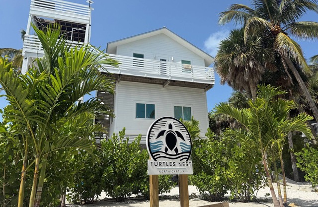 Gorgeously-appointed 4-bedroom beach home steps away from pristine beaches