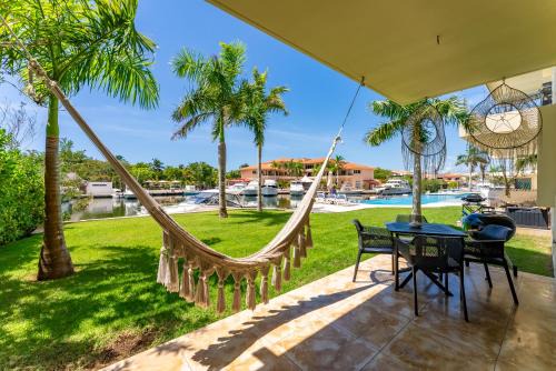 Ground Floor Paradise with Marina View and Pool Paddleboard Included