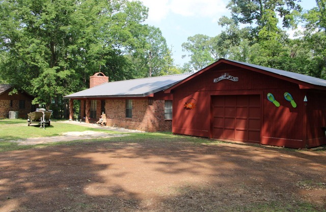Hawthorne Fish & Fun Lakehouse Game room, wet bar, fire ring, and floating dock.