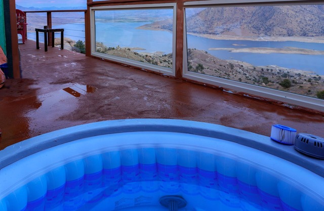 Intimate home . High on a mountainside with a hot tub on a deck.