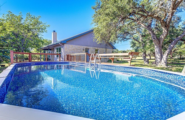 Hill country compound! Two 4 BDRM Homes with Pools On 8 Acres Riverfront